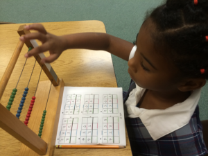 a girl playing abacus
